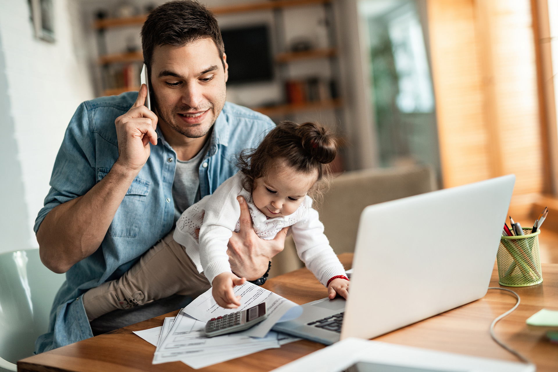 busy man working from home with child