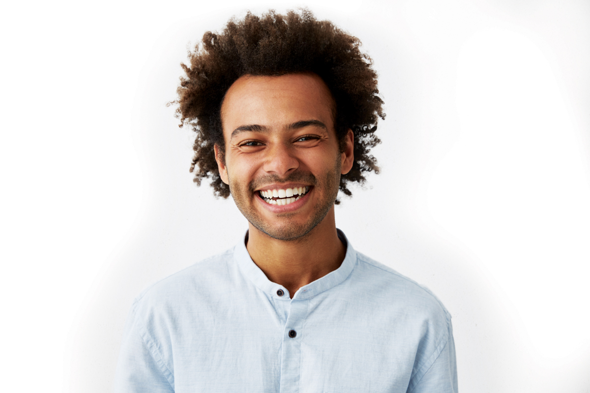 smiling young man with afro