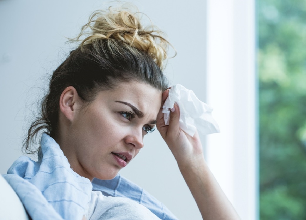 distressed woman with tissues