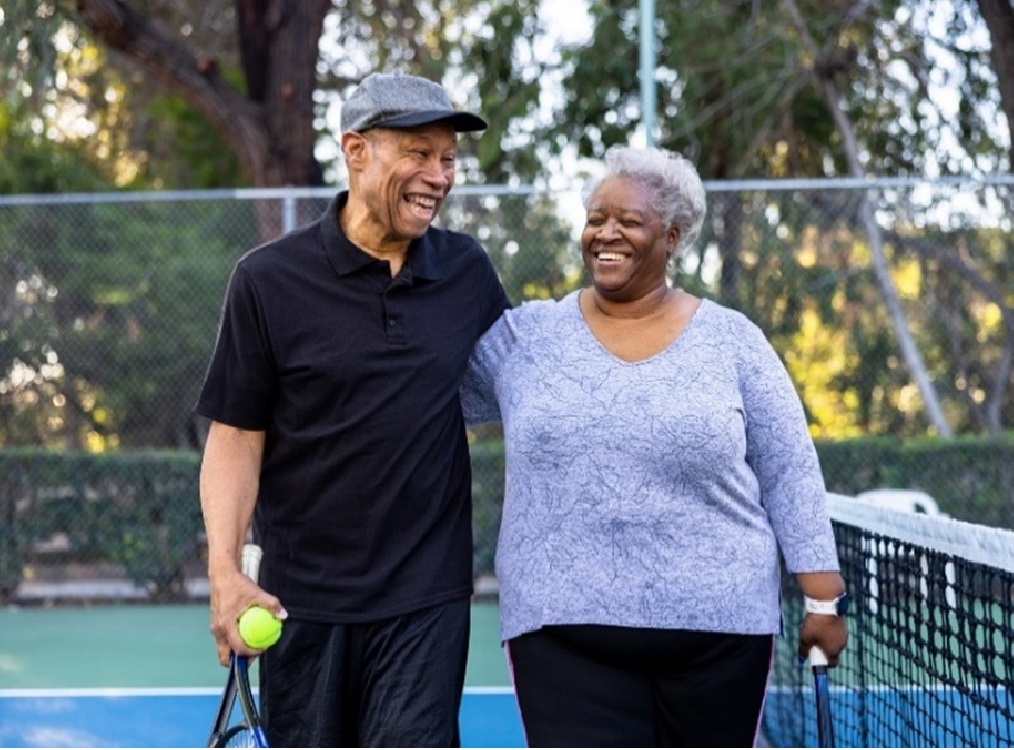 medicare couple on tennis court