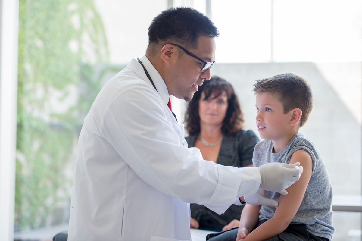 child vaccinated with doctor