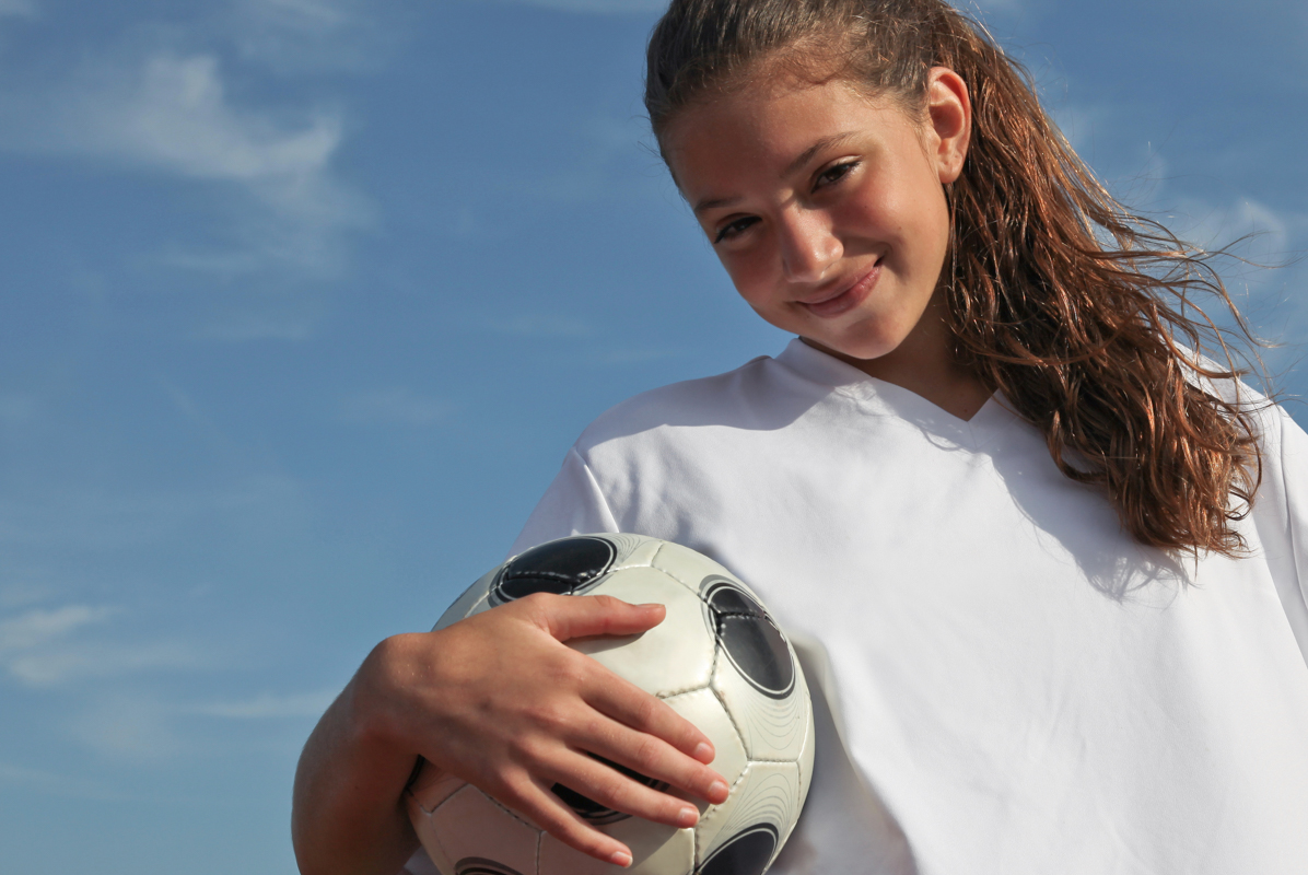 girl with soccer ball